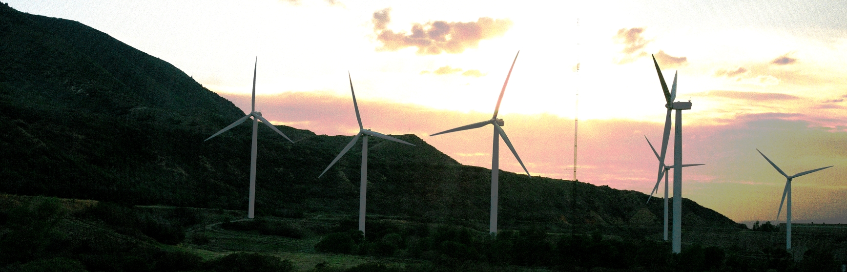 A collection of windmills in a field that, picture has been posterized so consists of only a few colors. Picture taken in Utah, edited in Krita.